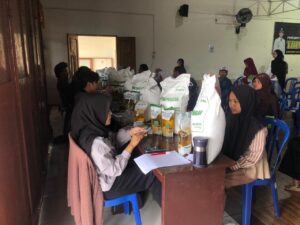 Pemerintah Kalurahan Trimulyo Laksanakan Penyaluran Beras CPP dan Minyak Goreng bagi Masyarakat